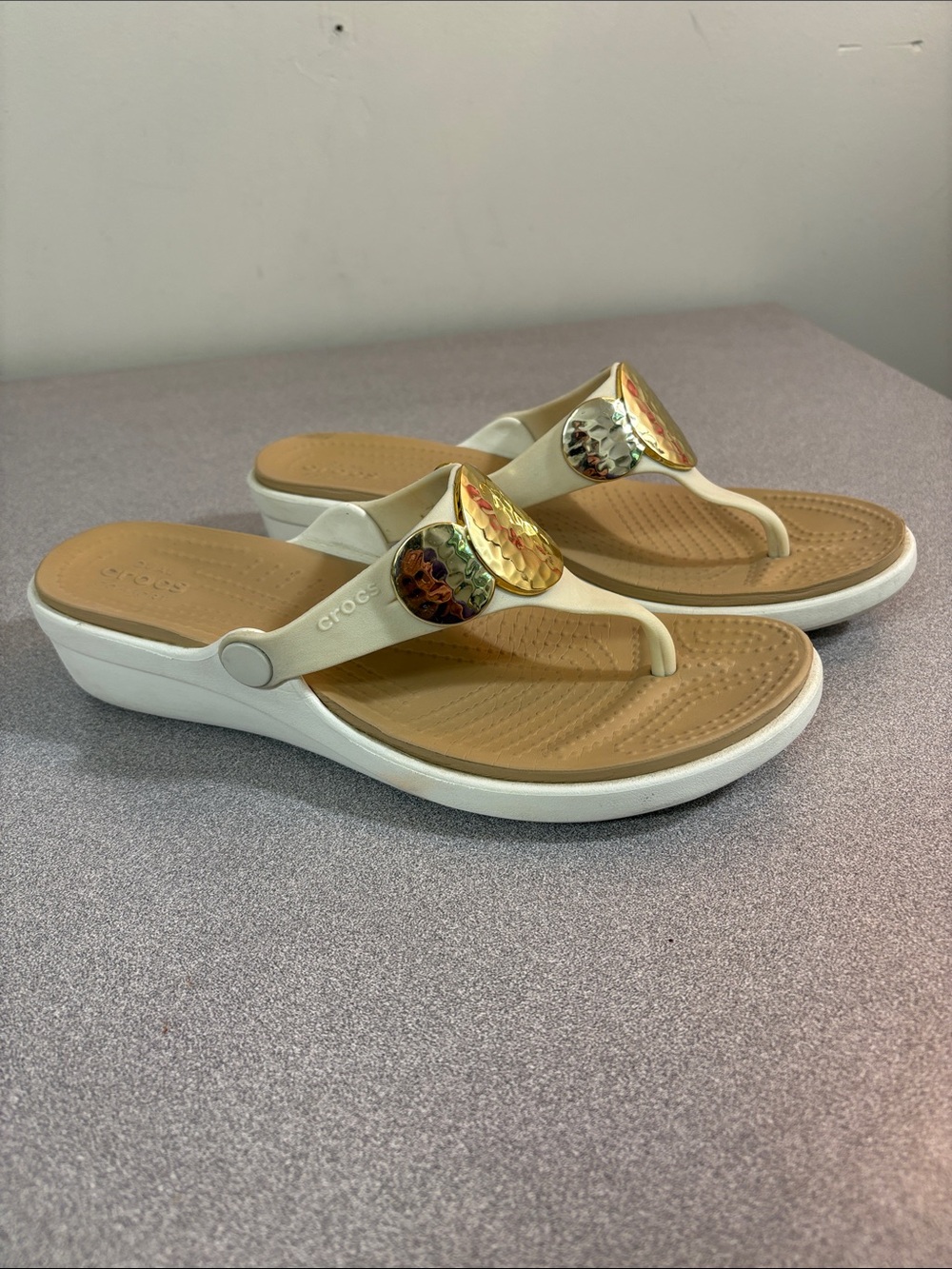 CROCS Sanra Cream Strap Tan Footbed Sandals with Gold Medallion